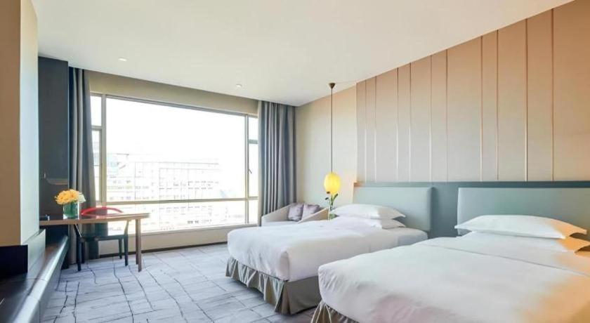 Maison New Century Hotel Dongguan Dongguan  Exteriör bild